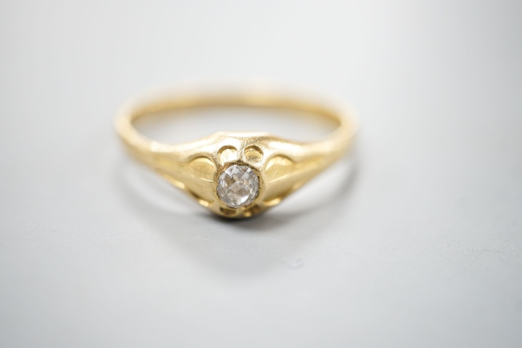 A Victorian 22ct gold and solitaire diamond set ring, London, 1875, size Z, gross weight 5 grams